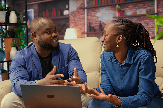 A close-up of two people looking at a digital tablet with legal documents.